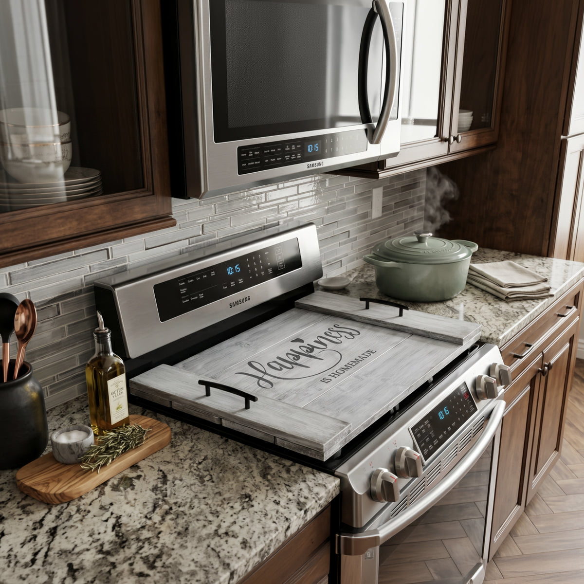 A rustic decorative wooden noodle board with distressed gray wood panels and black metal handles on the sides show in a kitchen setting. The center features the phrase 'Happiness is Homemade' in black lettering, with a small heart above the 'i' in 'Happiness'.