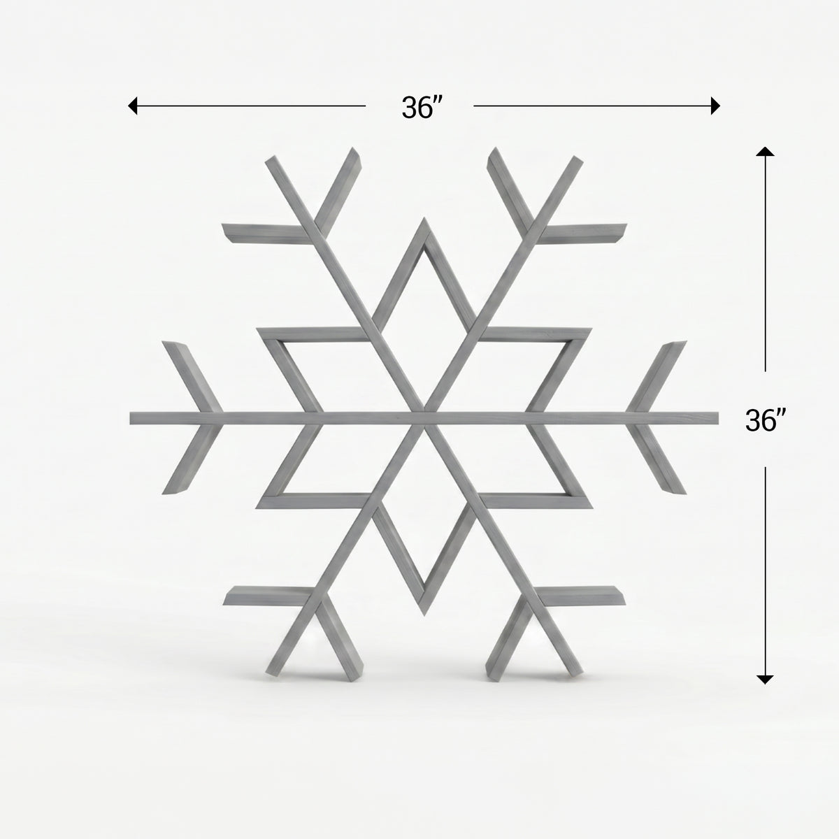 Gray snowflake-shaped wooden shelf with dimensions on a white background
